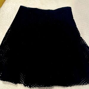Sandro Mini skirt lined with holes. Very cute